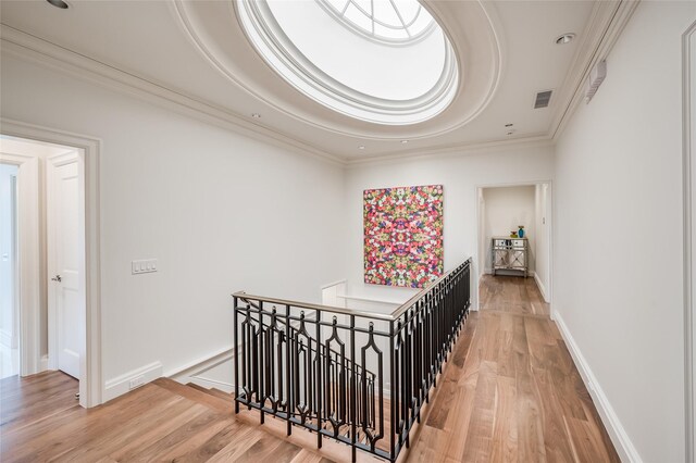2131 Brentwood Dr, Houston, TX 77019 - corridor with an upstairs landing, light wood finished floors, crown molding, recessed lighting, and baseboards