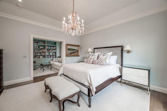 2131 Brentwood Dr, Houston, TX 77019 - bedroom with wood finished floors, a chandelier, baseboards, and ornamental molding