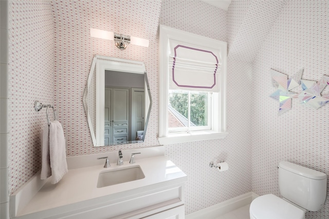 2131 Brentwood Dr, Houston, TX 77019 - bathroom with wallpapered walls, toilet, and vanity