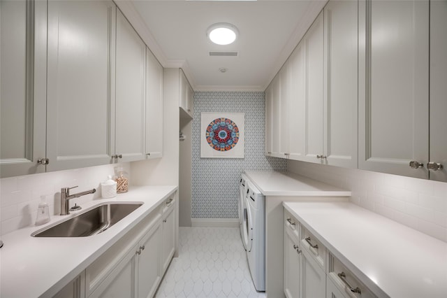 2131 Brentwood Dr, Houston, TX 77019 - laundry area with cabinet space, baseboards, ornamental molding, and wallpapered walls