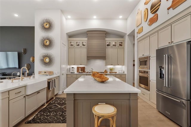2142 Almond Creek Ln, Brookshire, TX 77423 - kitchen with a kitchen breakfast bar, stainless steel appliances, light countertops, and a sink