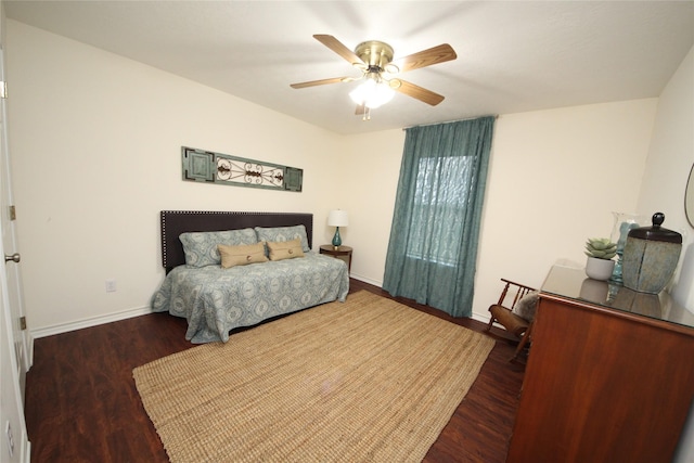bedroom featuring baseboards, ceiling fan, and wood finished floors