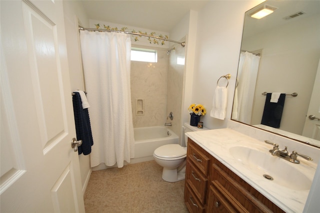 bathroom with toilet, vanity, shower / bath combo with shower curtain, and visible vents