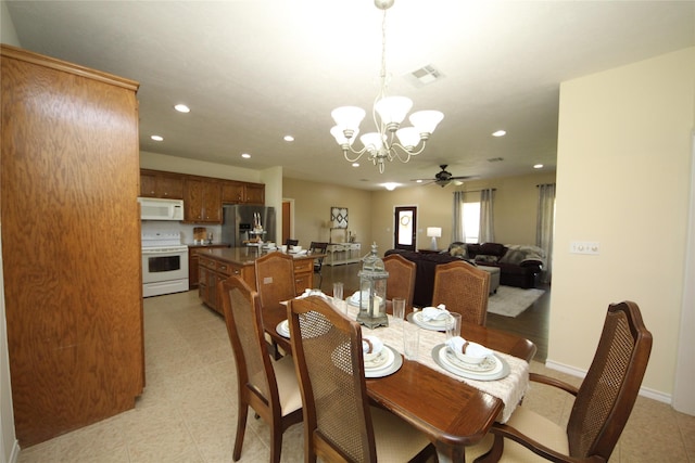 dining area featuring recessed lighting, ceiling fan with notable chandelier, baseboards, and visible vents