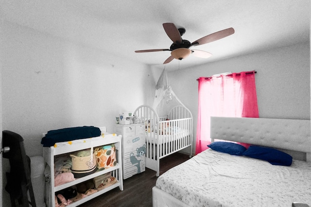 2105 Russell St, Houston, TX 77026 - bedroom with a ceiling fan and wood finished floors
