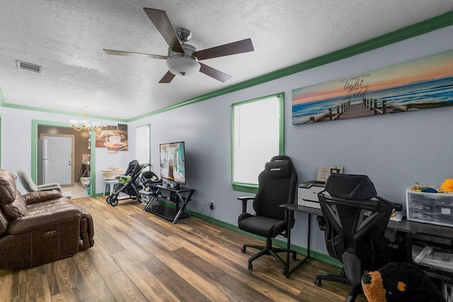 2105 Russell St, Houston, TX 77026 - office with visible vents, ceiling fan with notable chandelier, a textured ceiling, wood finished floors, and baseboards