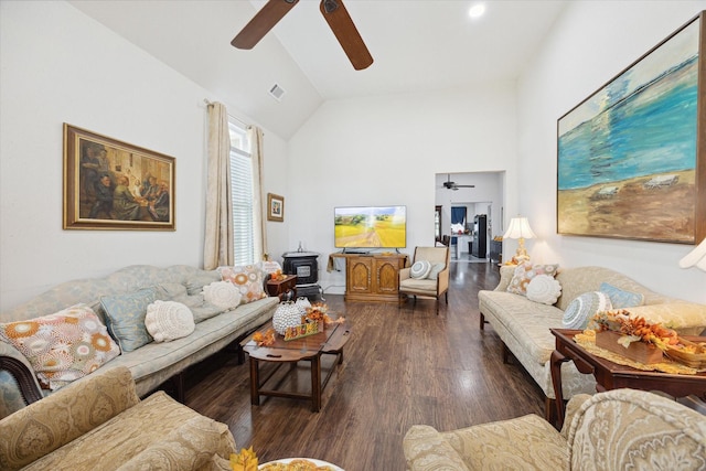 725 Columbus Rd, Sealy, TX 77474 - living room with visible vents, a wood stove, ceiling fan, and wood finished floors
