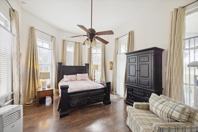 725 Columbus Rd, Sealy, TX 77474 - bedroom featuring dark wood finished floors, heating unit, and a ceiling fan