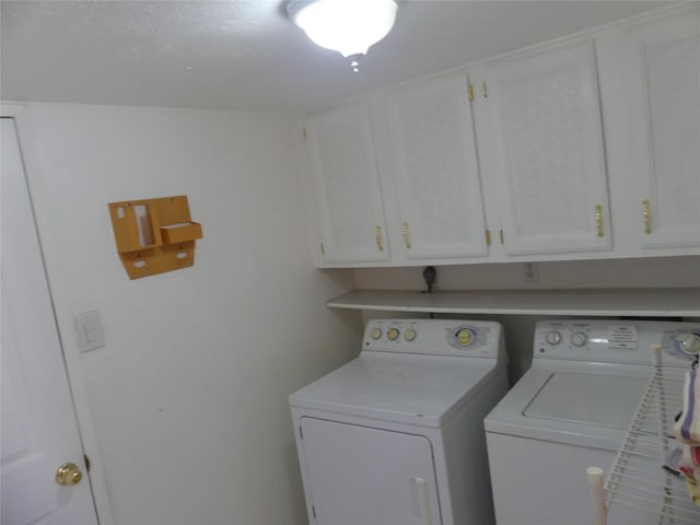 clothes washing area with cabinet space and washing machine and clothes dryer