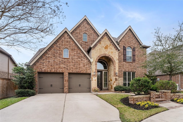 17131 Lumberton Dr, Cypress, TX 77433 - traditional home featuring brick siding, concrete driveway, stone siding, and fence