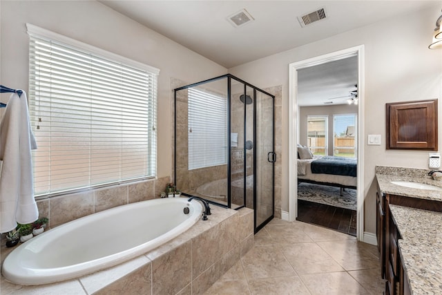 17131 Lumberton Dr, Cypress, TX 77433 - ensuite bathroom featuring a shower stall, vanity, a bath, and tile patterned floors