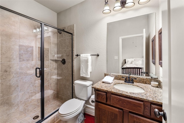 17131 Lumberton Dr, Cypress, TX 77433 - ensuite bathroom featuring a shower stall, toilet, vanity, and a textured wall