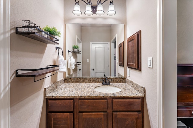 17131 Lumberton Dr, Cypress, TX 77433 - bathroom featuring a textured wall and vanity