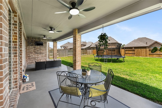 17131 Lumberton Dr, Cypress, TX 77433 - view of patio with a trampoline, ceiling fan, an outdoor hangout area, and outdoor dining area