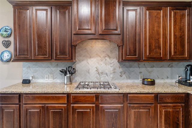 17131 Lumberton Dr, Cypress, TX 77433 - kitchen featuring stainless steel gas stovetop, backsplash, and light stone counters