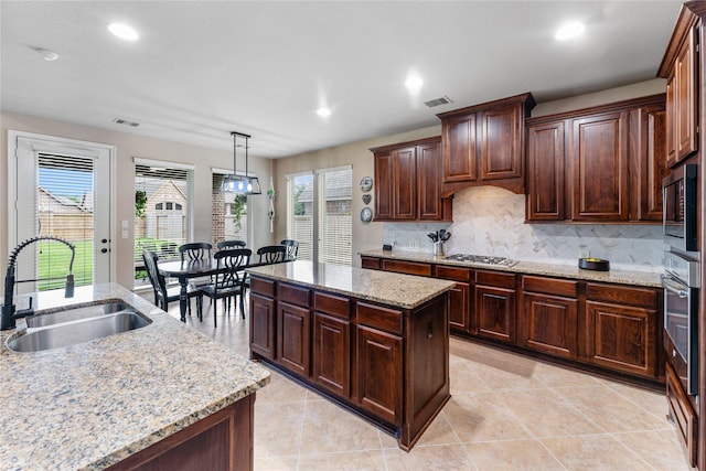 17131 Lumberton Dr, Cypress, TX 77433 - kitchen featuring a sink, stainless steel appliances, plenty of natural light, recessed lighting, and tasteful backsplash