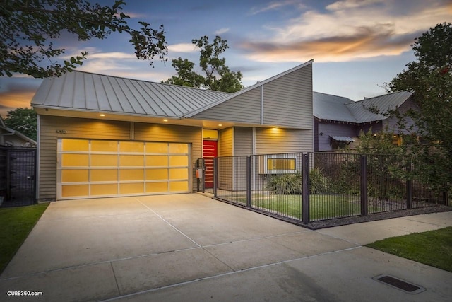 1035 Rutland St, Houston, TX 77008 - modern home with concrete driveway, a garage, a standing seam roof, and metal roof
