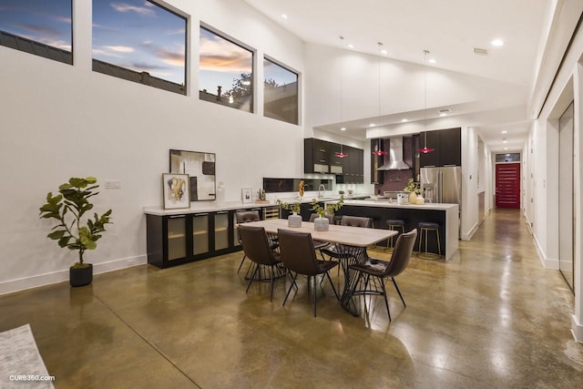 1035 Rutland St, Houston, TX 77008 - dining space featuring concrete flooring, baseboards, high vaulted ceiling, and recessed lighting