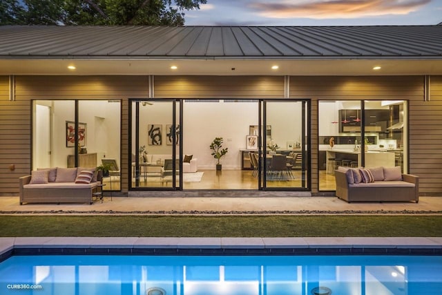 1035 Rutland St, Houston, TX 77008 - back of house featuring a standing seam roof, metal roof, an outdoor pool, and outdoor lounge area