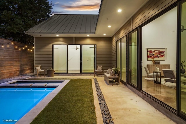 1035 Rutland St, Houston, TX 77008 - pool at dusk featuring a hot tub