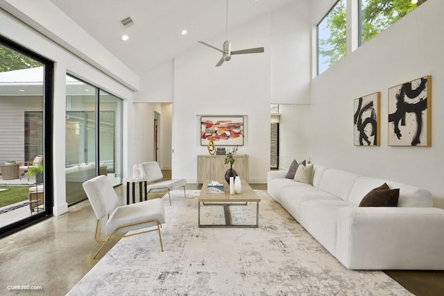 1035 Rutland St, Houston, TX 77008 - living area with a high ceiling, recessed lighting, a ceiling fan, baseboards, and concrete flooring