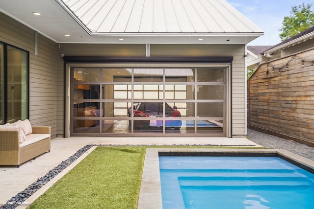 1035 Rutland St, Houston, TX 77008 - back of house with a standing seam roof, metal roof, an outdoor pool, and a patio