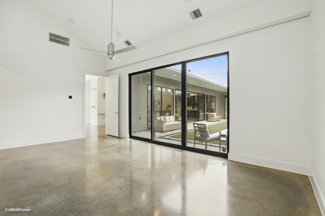 1035 Rutland St, Houston, TX 77008 - empty room featuring finished concrete flooring and baseboards
