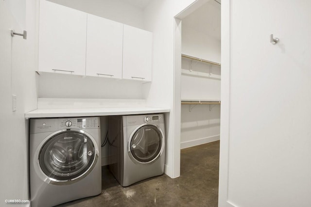 1035 Rutland St, Houston, TX 77008 - laundry area featuring washing machine and dryer and cabinet space