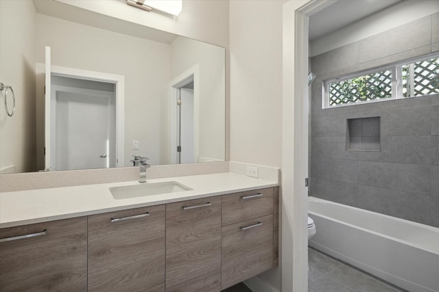 full bathroom featuring toilet, bathtub / shower combination, vanity, and tile patterned flooring