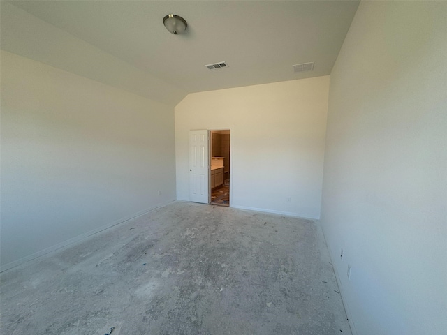 19122 Hazel Firs Ln, Magnolia, TX 77355 - unfurnished room featuring vaulted ceiling, concrete floors, and baseboards