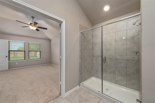 full bath featuring a stall shower, baseboards, ceiling fan, and vaulted ceiling