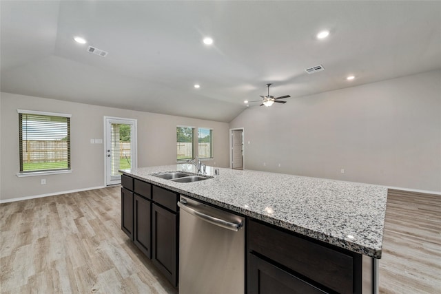 kitchen with visible vents, lofted ceiling, a sink, light wood-style floors, and dishwasher