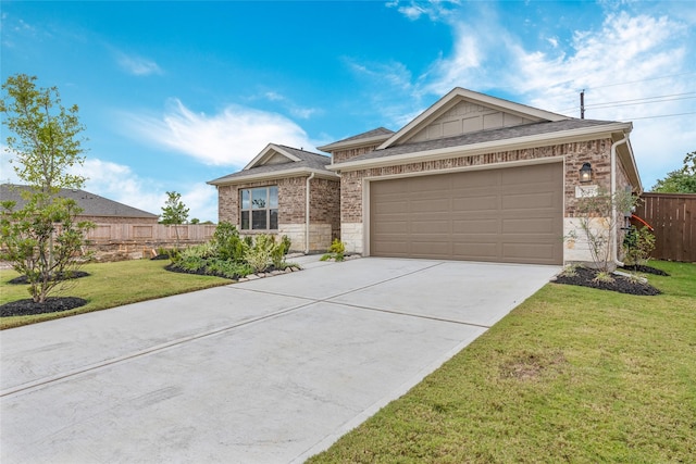 ranch-style home with a front lawn, stone siding, fence, concrete driveway, and a garage