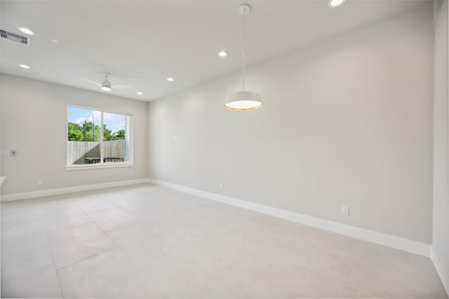 unfurnished room with visible vents, baseboards, and recessed lighting