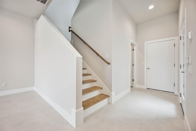 entryway featuring stairway and recessed lighting