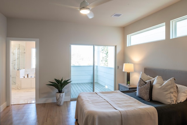 bedroom with access to exterior, light wood-style floors, visible vents, baseboards, and ensuite bath