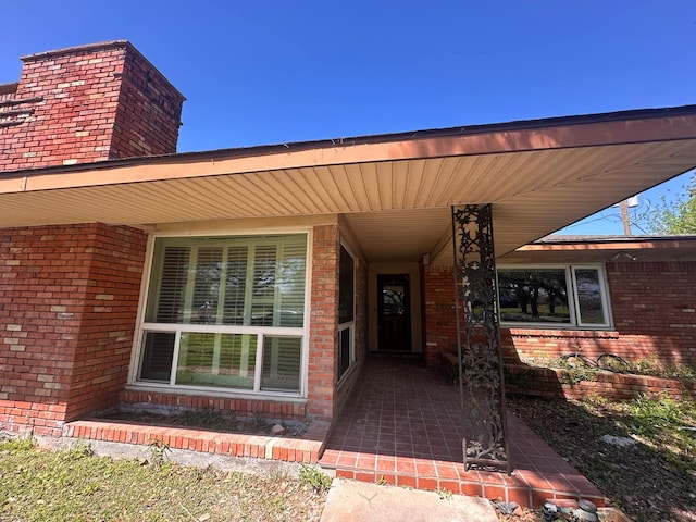 entrance to property with brick siding