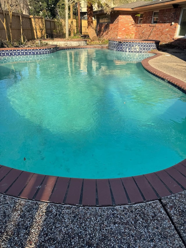 view of pool with a fenced in pool and fence private yard