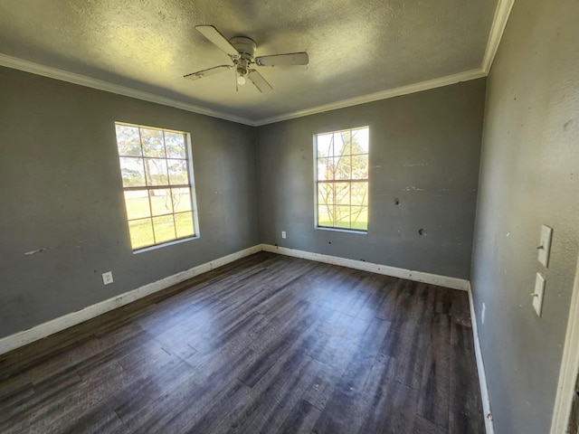 empty room with a ceiling fan, a textured ceiling, baseboards, and dark wood finished floors
