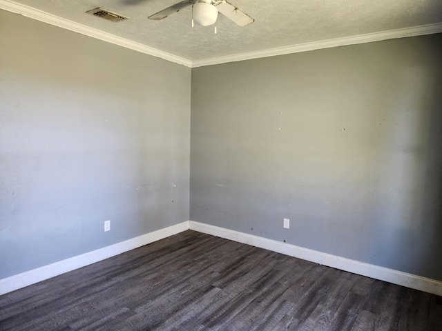 empty room with a textured ceiling, baseboards, dark wood finished floors, and visible vents