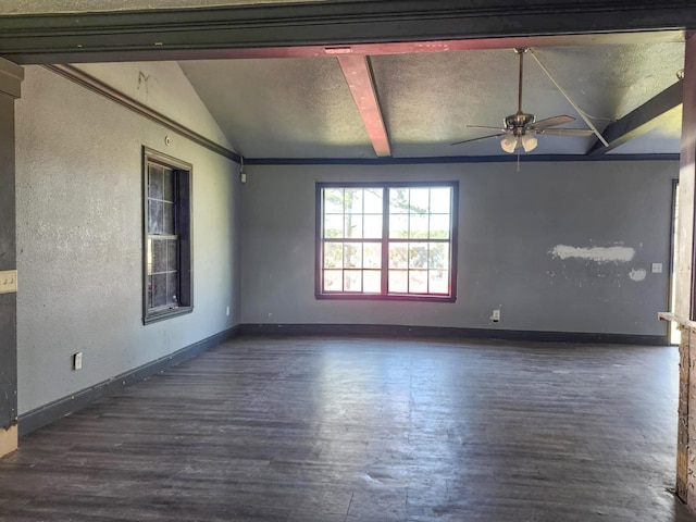 unfurnished room featuring wood finished floors, ceiling fan, lofted ceiling with beams, and baseboards