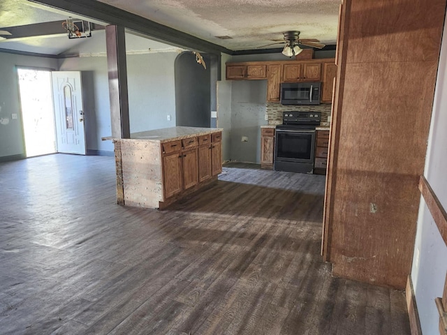 kitchen with brown cabinets, ceiling fan, black range with electric stovetop, and dark wood-type flooring