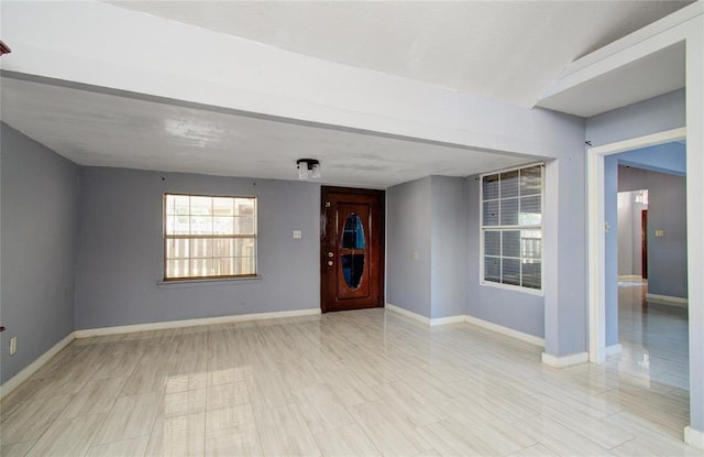 empty room featuring baseboards