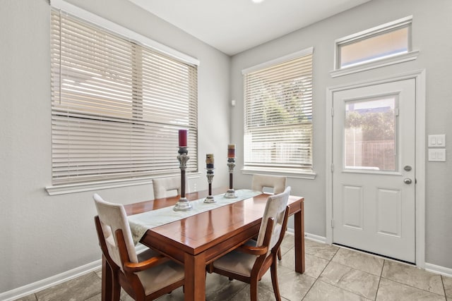 dining space featuring baseboards