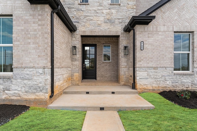 property entrance featuring stone siding
