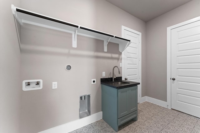 laundry room featuring a sink, hookup for an electric dryer, laundry area, baseboards, and hookup for a washing machine