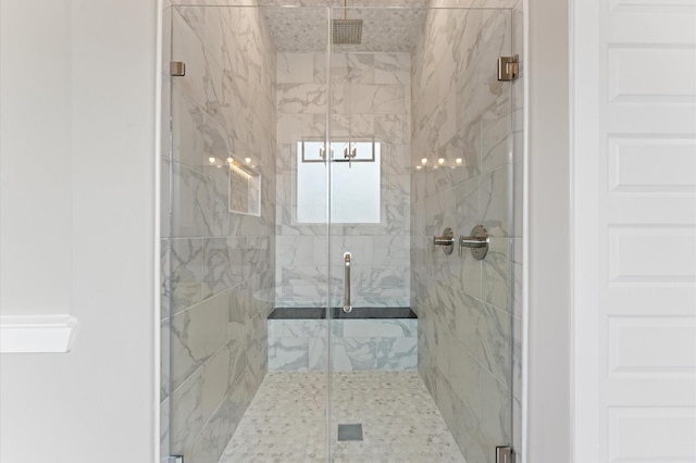 full bath with a shower stall