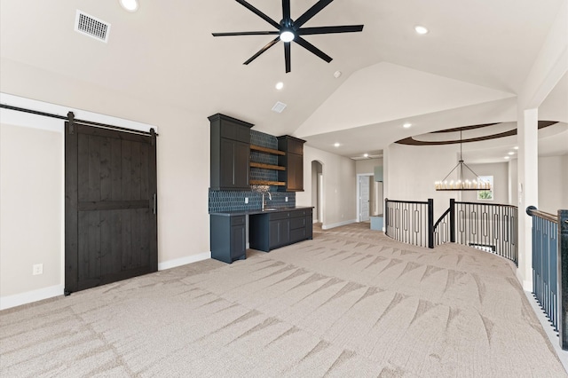 unfurnished living room with visible vents, baseboards, light carpet, arched walkways, and ceiling fan with notable chandelier