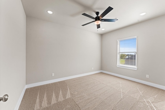 spare room featuring a ceiling fan, carpet, baseboards, and recessed lighting
