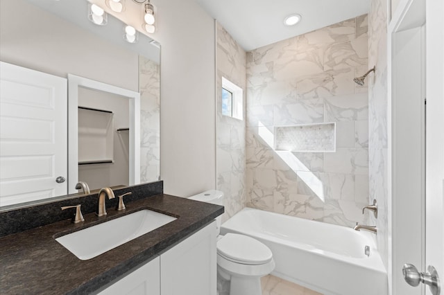 bathroom featuring marble finish floor, toilet, vanity, and shower / tub combination